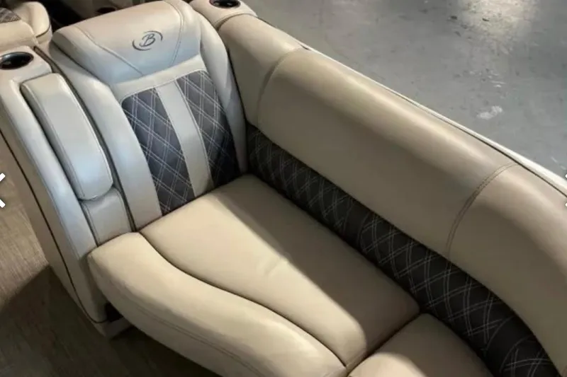 Slide: The Image of 2021 Barletta L23UC boat seat with beige and patterned upholstery. - 20