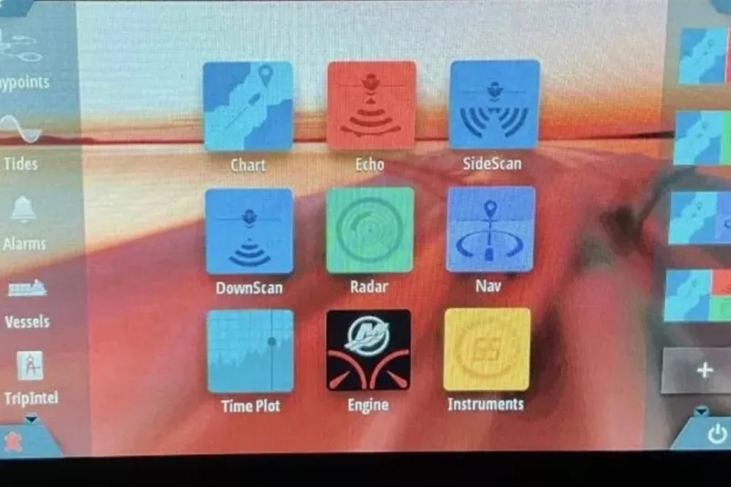 Slide: The Image of Touchscreen interface displaying navigation and sonar options on a 2021 Barletta L23UC boat. - 23