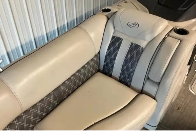 Slide: The Image of 2021 Barletta L23UC boat seat with beige and diamond-patterned upholstery. - 26