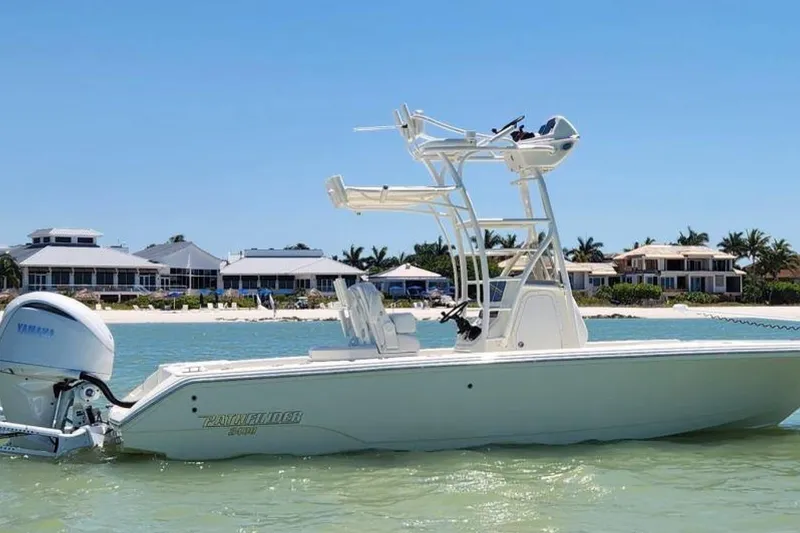The Image of 2024 Pathfinder 2400 Open boat on water, with coastal homes in the background. - 0