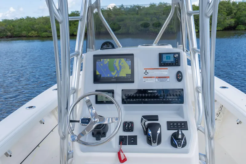 Slide: The Image of Manufacturer Provided Image: 2024 Pathfinder 2400 Open boat console with navigation system and controls. - 4