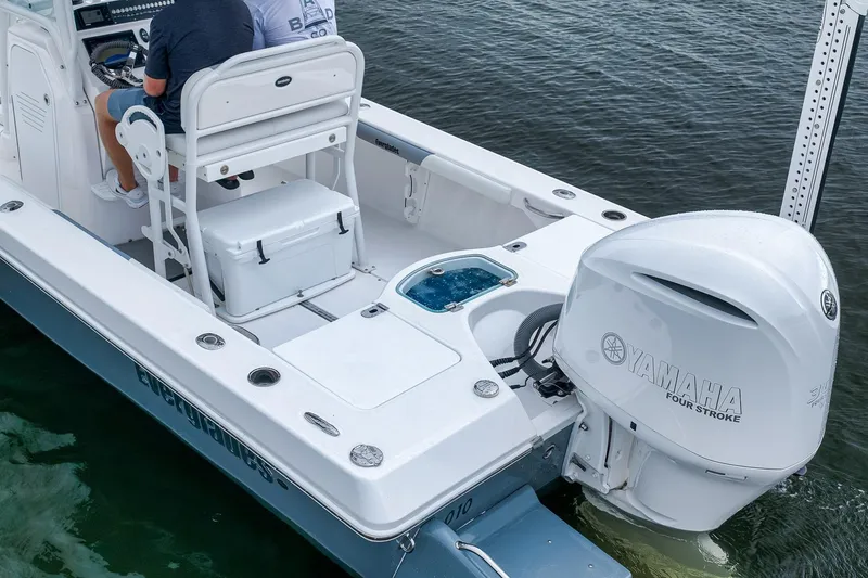 Slide: The Image of 2018 Everglades 243 Center Console boat with Yamaha four-stroke engine on water. - 12