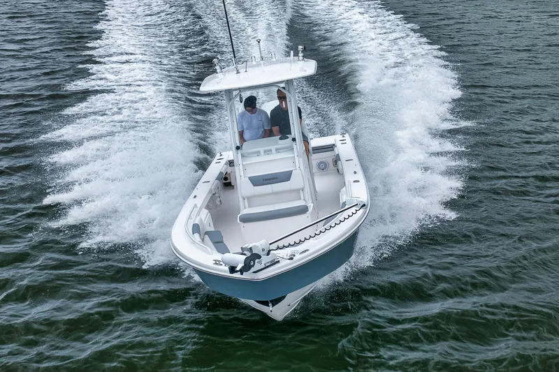 Slide: The Image of 2018 Everglades 243 Center Console boat cruising on open water. - 24