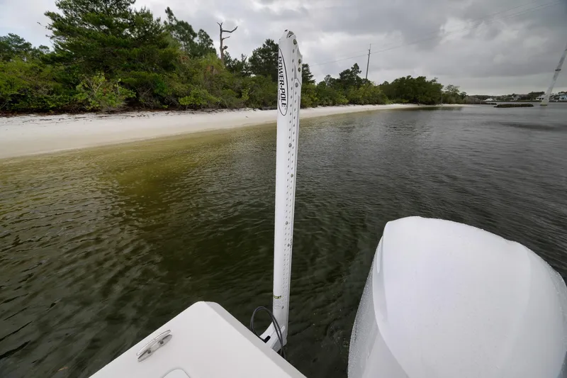 Slide: The Image of Everglades 243 Center Console boat near a sandy shoreline, 2018 model. - 35