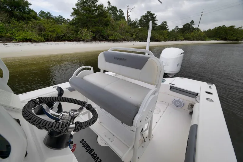 Slide: The Image of 2018 Everglades 243 Center Console boat near a sandy shoreline. - 36