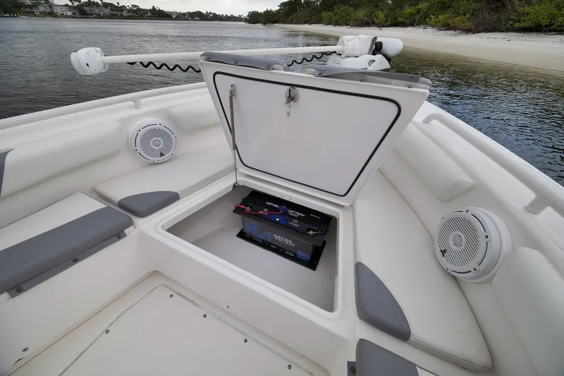 Slide: The Image of Open storage compartment on 2018 Everglades 243 Center Console boat, featuring marine speakers. - 44