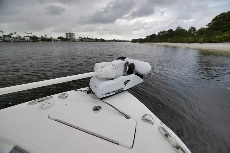 Slide: The Image of 2018 Everglades 243 Center Console boat with trolling motor on calm waters. - 46