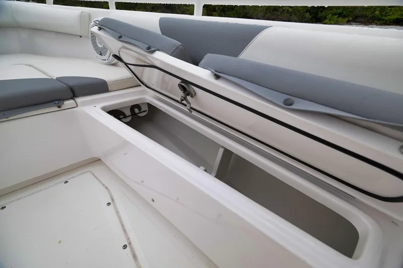 Slide: The Image of Open storage compartment on 2018 Everglades 243 Center Console boat. - 49