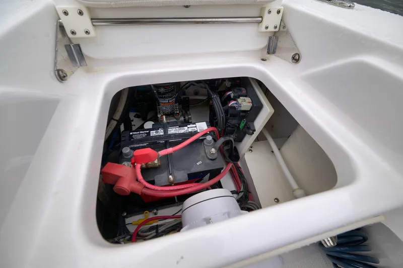 Slide: The Image of 2018 Everglades 243 Center Console boat battery compartment with wiring and components. - 51
