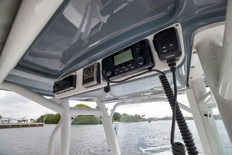 Slide: The Image of 2018 Everglades 243 Center Console boat with Garmin marine electronics and communication equipment. - 52
