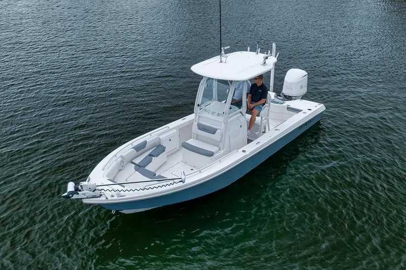 Slide: The Image of 2018 Everglades 243 Center Console boat on calm water, featuring sleek design and modern amenities. - 9