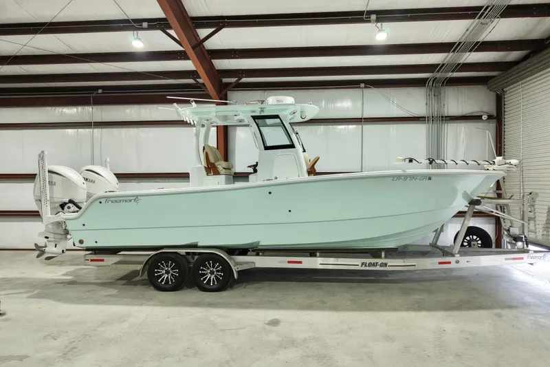 The Image of 2024 Freeman 28 boat on trailer in indoor storage facility. - 0