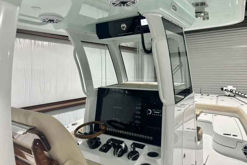 Slide: The Image of 2024 Freeman 28 boat interior with modern dashboard and steering wheel. - 19