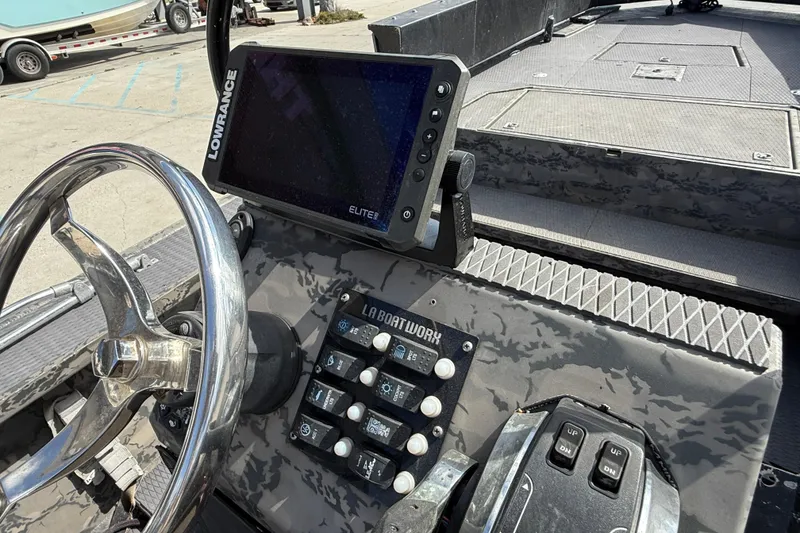 Slide: The Image of 2018 Gator Tail Extreme Series 2060cc boat dashboard with Lowrance Elite display. - 13