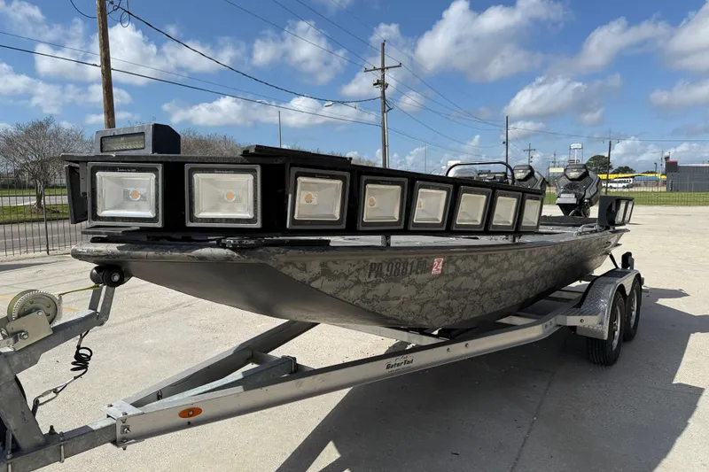 Slide: The Image of 2018 Gator Tail Extreme Series 2060cc boat on trailer with multiple front lights. - 3