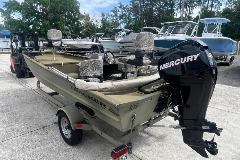 Slide: The Image of 2011 Tracker Grizzly 1754 Side Console boat with Mercury engine on trailer. - 4