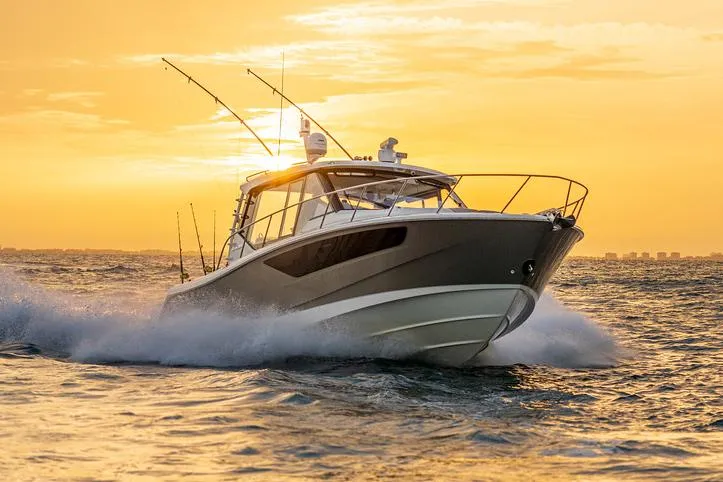 Slide: The Image of Manufacturer Provided Image: Boston Whaler 405 Conquest 2026 cruising at sunset on open water. - 2