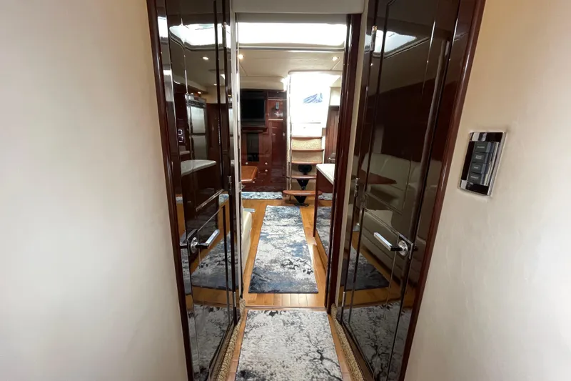 Slide: The Image of Luxurious interior of 2009 Sea Ray 480 Sundancer yacht with polished wood and elegant decor. - 18