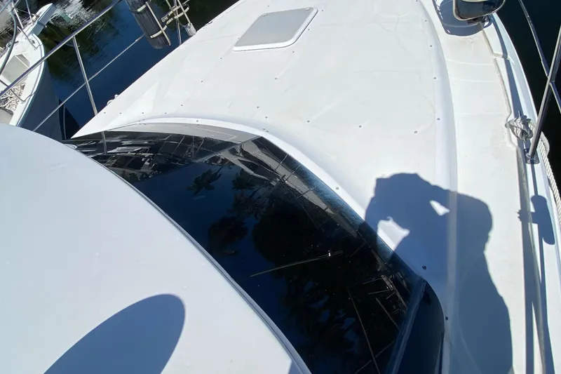 Slide: The Image of 2003 Carver 356 Motor Yacht deck with shadow and reflections. - 10