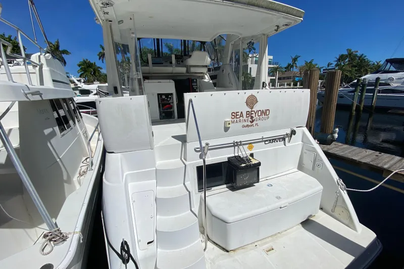Slide: The Image of 2003 Carver 356 Motor Yacht docked, featuring "Sea Beyond Marine Group" branding. - 13