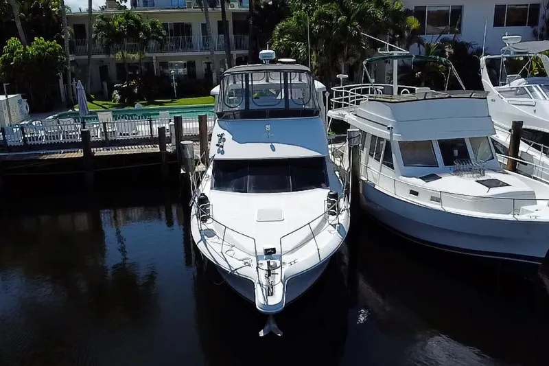Slide: The Image of 2003 Carver 356 Motor Yacht docked beside another boat in a marina. - 3