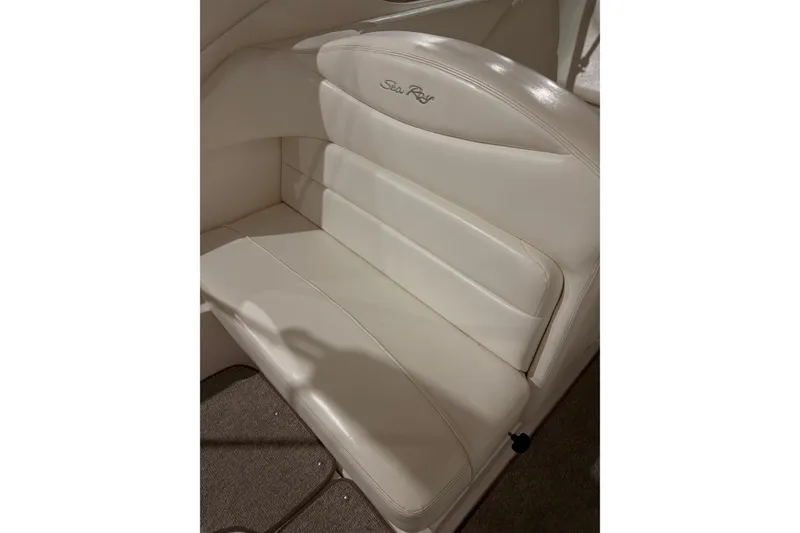 Slide: The Image of 2004 Searay 280 Sundancer boat seat with white leather upholstery. - 4
