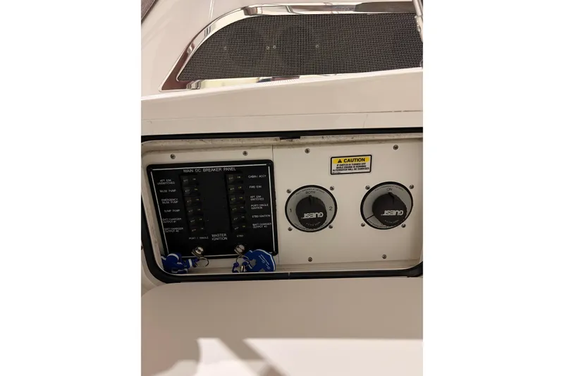 Slide: The Image of Control panel of a 2004 Searay 280 Sundancer boat with switches and dials. - 6