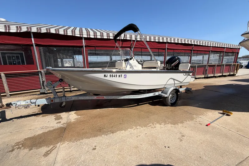 The Image of 2024 Boston Whaler 170 Montauk boat on trailer, parked outdoors. - 0