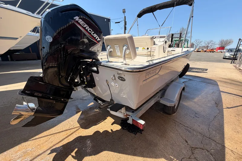Slide: The Image of 2024 Boston Whaler 170 Montauk boat with Mercury engine on trailer. - 3