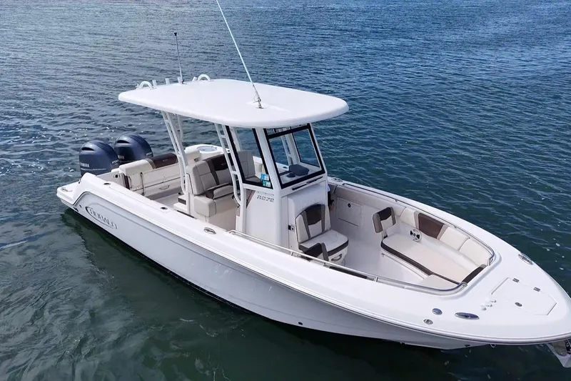 Slide: The Image of 2020 Robalo R272 Center Console boat on calm water. - 14
