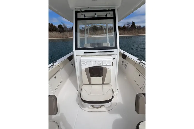 Slide: The Image of 2020 Robalo R272 Center Console boat interior with seating and console view. - 24