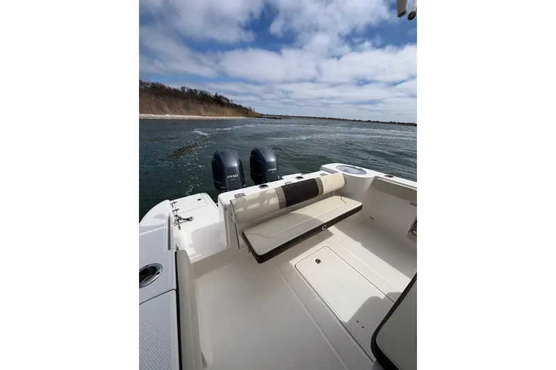 Slide: The Image of 2020 Robalo R272 Center Console boat with dual engines on open water. - 29