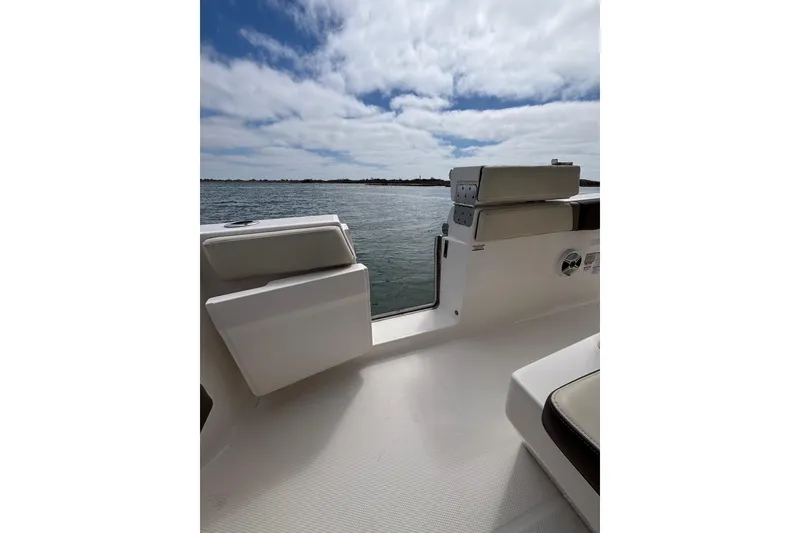 Slide: The Image of 2020 Robalo R272 Center Console boat interior with open water view. - 35