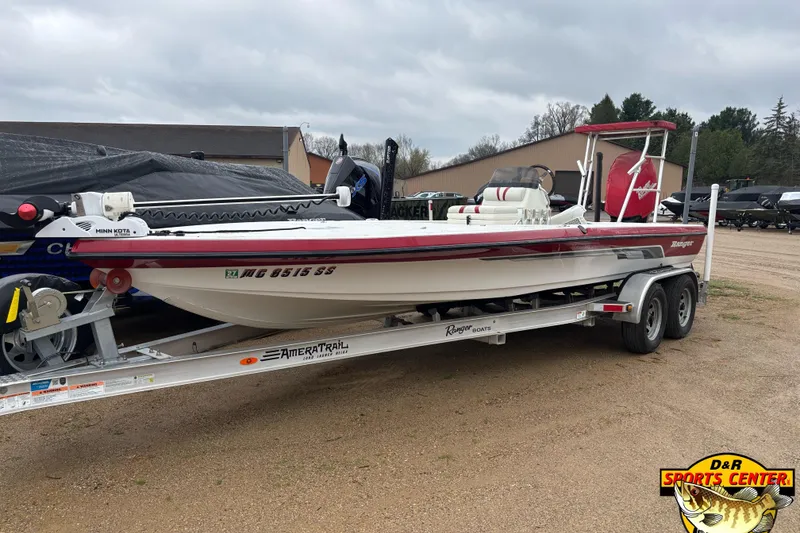 Slide: The Image of 2005 Ranger 223 Cayman boat on trailer, featuring Minn Kota trolling motor. - 2