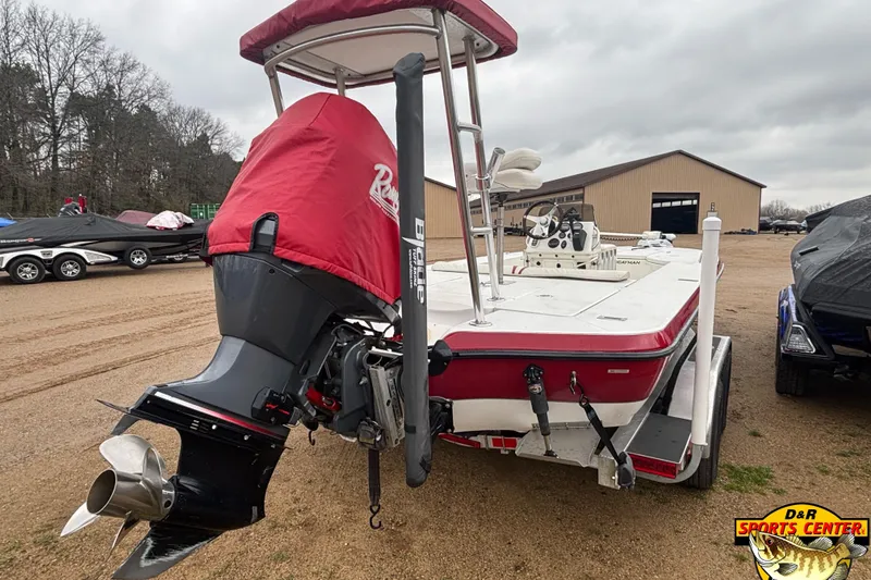 Slide: The Image of 2005 Ranger 223 Cayman boat with covered motor, parked outdoors on a trailer. - 4
