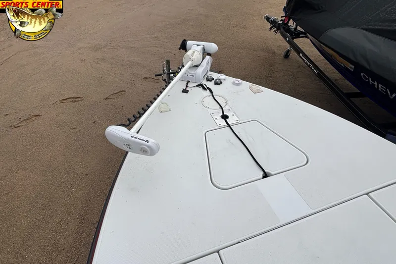 Slide: The Image of 2005 Ranger 223 Cayman boat deck with trolling motor on sandy shore. - 7