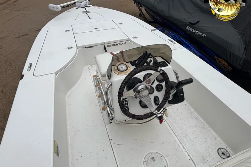 Slide: The Image of 2005 Ranger 223 Cayman boat interior with steering wheel and control panel. - 8