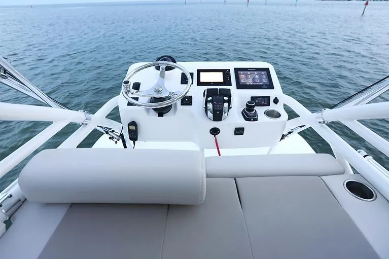 Slide: The Image of Manufacturer Provided Image: Boston Whaler 380 Outrage 2025 helm with modern controls on open water. - 10