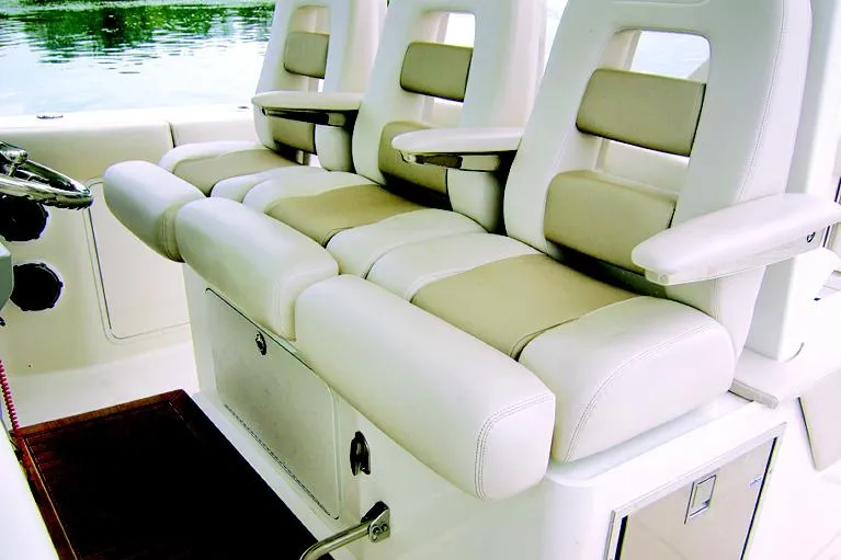 Slide: The Image of Manufacturer Provided Image: 2025 Boston Whaler 380 Outrage interior seating, luxurious white and beige design. - 12