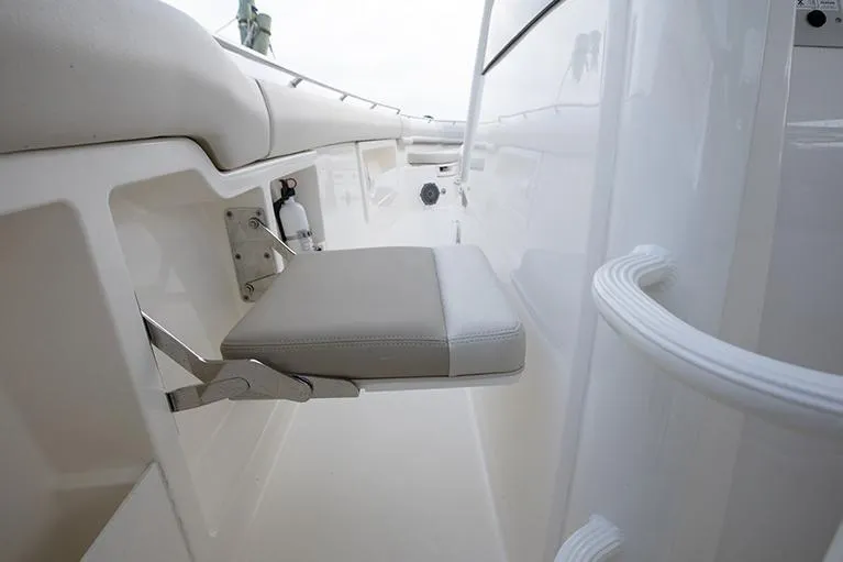 Slide: The Image of Manufacturer Provided Image: 2025 Boston Whaler 380 Outrage interior seating detail, white and sleek design. - 15
