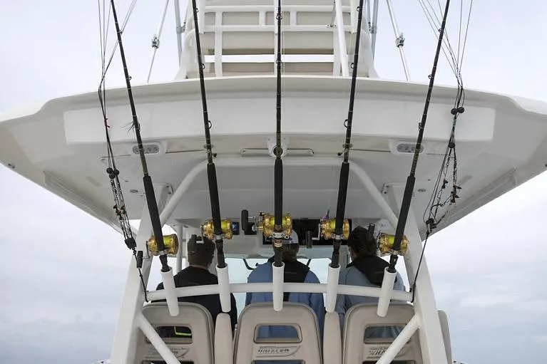 Slide: The Image of Manufacturer Provided Image: 2025 Boston Whaler 380 Outrage with fishing rods, rear view. - 7