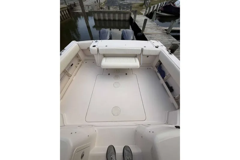 Slide: The Image of 2013 Grady-White Express 330 boat deck with seating, docked at marina. - 10
