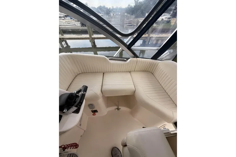 Slide: The Image of Interior of 2013 Grady-White Express 330 boat with cream seating and helm. - 16