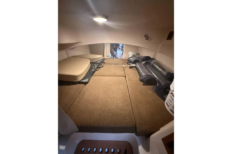 Slide: The Image of Interior cabin of 2013 Grady-White Express 330 boat with cushioned seating. - 20