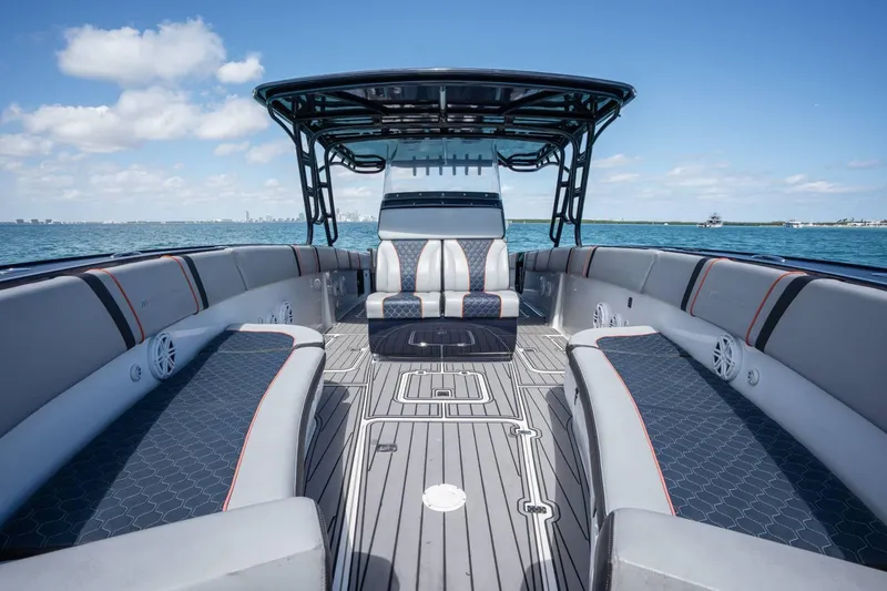 Slide: The Image of 2014 Midnight Express 37 Open boat interior with sleek seating and ocean view. - 13