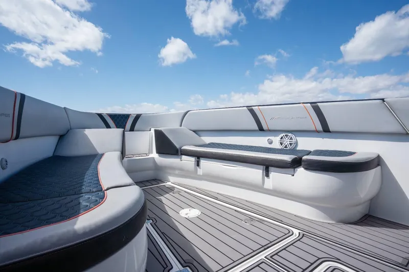 Slide: The Image of Luxurious seating on 2014 Midnight Express 37 Open boat under blue sky. - 16