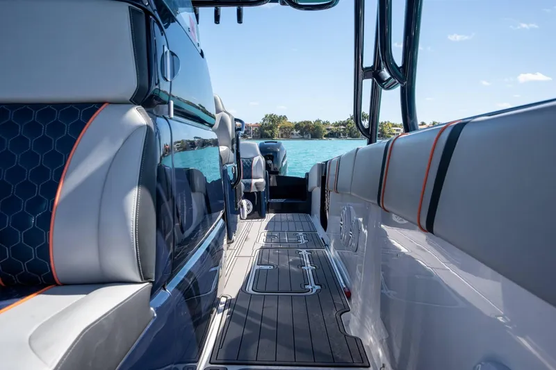 Slide: The Image of Interior view of 2014 Midnight Express 37 Open boat with sleek seating and ocean backdrop. - 22