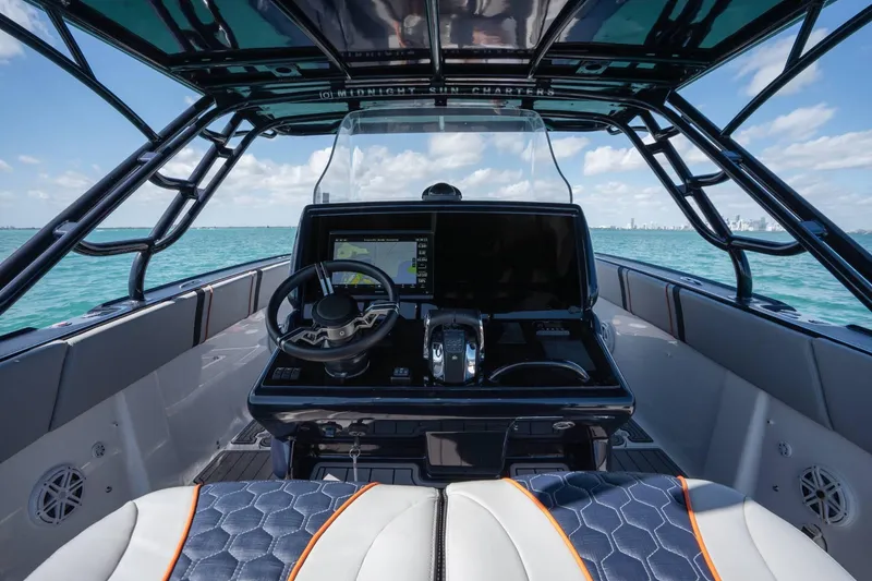Slide: The Image of Cockpit view of 2014 Midnight Express 37 Open boat on the ocean. - 24