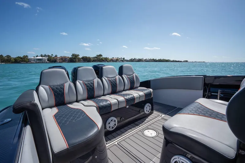 Slide: The Image of Luxurious seating on a 2014 Midnight Express 37 Open boat, cruising on clear blue waters. - 27