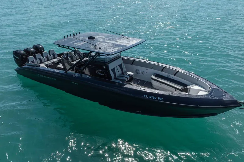 Slide: The Image of 2014 Midnight Express 37 Open boat on clear turquoise water. - 8